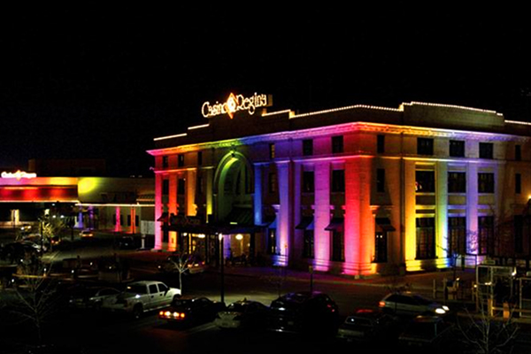 Casino Regina building lit up at night with multi-colored LEDs 