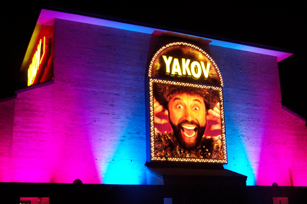 Yakov Smirnoff Show building lit at night using City Color 2500s and Dominator architectural lights by Studio DueStudio Due 