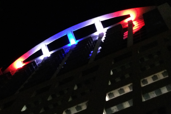 Solaire at the Plaza Condos of Orlando lit at night with red white and blue Quadro 24 LEDs