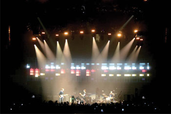 SGM Giotto 400 Spot CMY moving head lights on the band Coldplay's Twisted Logic World Tour, United Kingdom