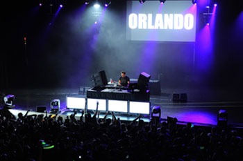 DJ Tiesto performing on stage with purple and white moving head lights - Hard Rock Orlando Live, Florida USA