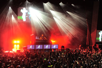 SGM Palco 3s with red LEDs and moving lights shining beams of white light out into crowd and DJ Tiesto - Hard Rock Orlando Live, Florida USA