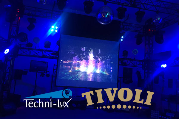Techni-Lux showroom lit with blue LED lights with screen projecting TIVOLI Gardens